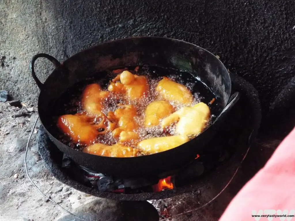 Malagasy banana fritters frying