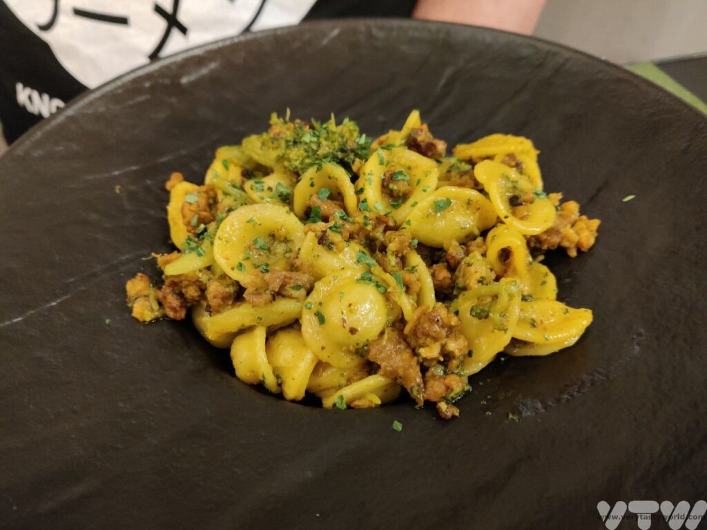 Fagioli con Salsicce a bowl of pasta with tuscan sausage