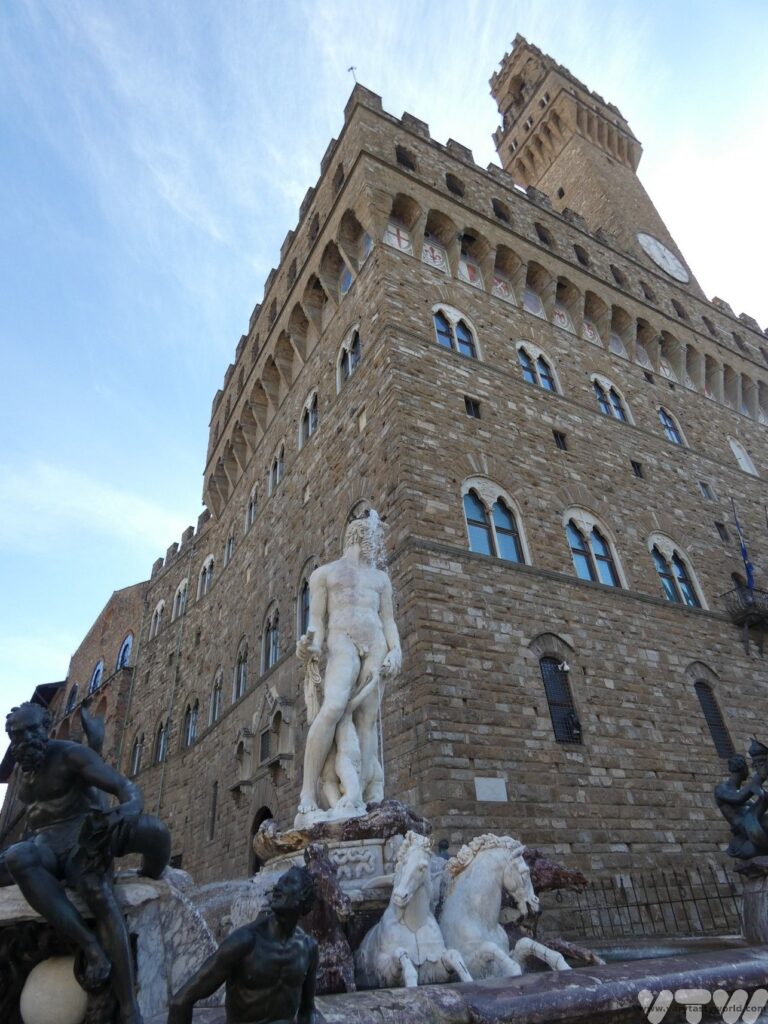 Neptune statue surrounded by horses in fountain at Piazza Vecchio