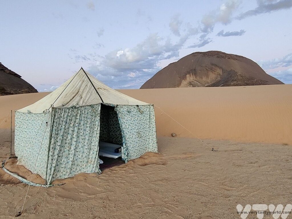 things to do in Mauritania - tent with Ben Amera in the background