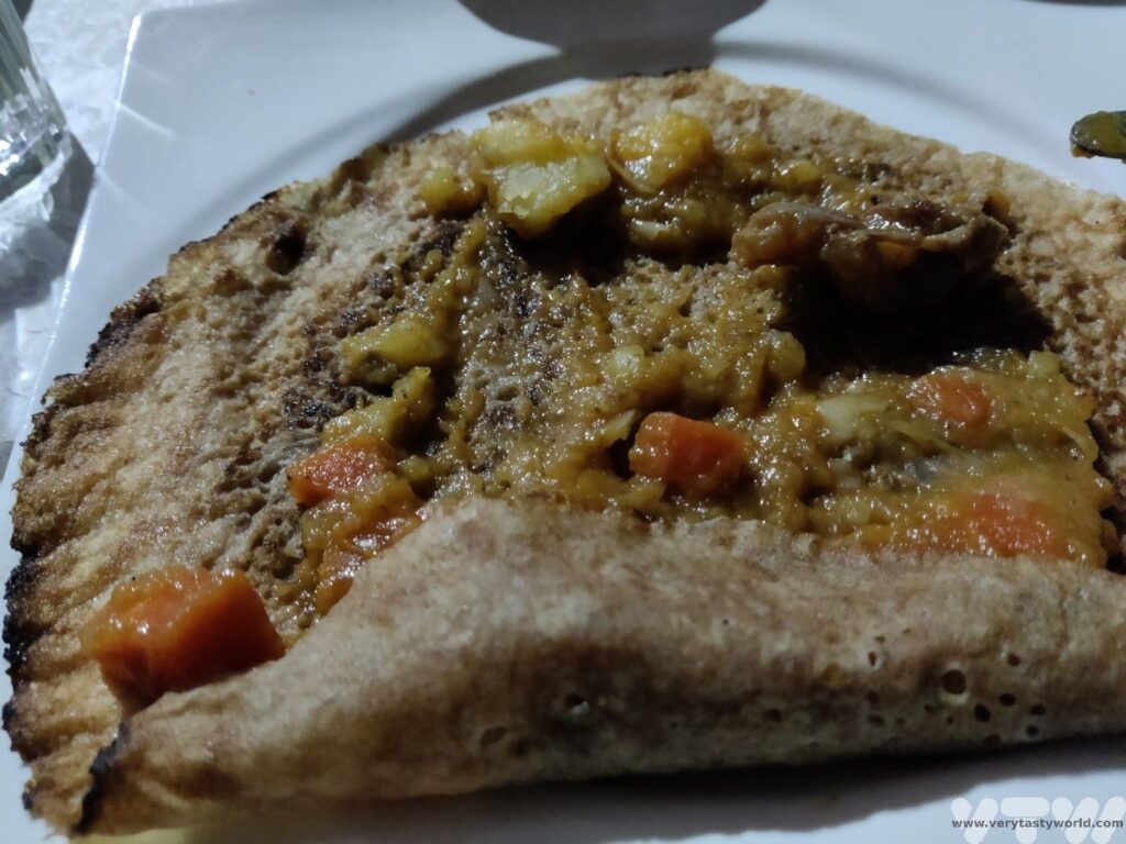 leksour - pancake smothered with stew