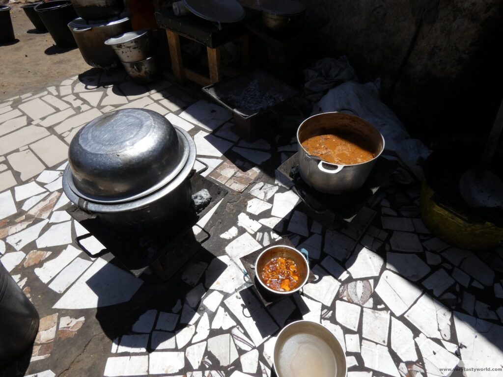 pots and pans on the fire as the theibouden cooks