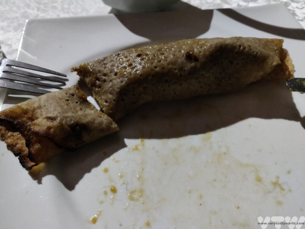 leksour - pancake smothered with stew and rolled into a cylinder