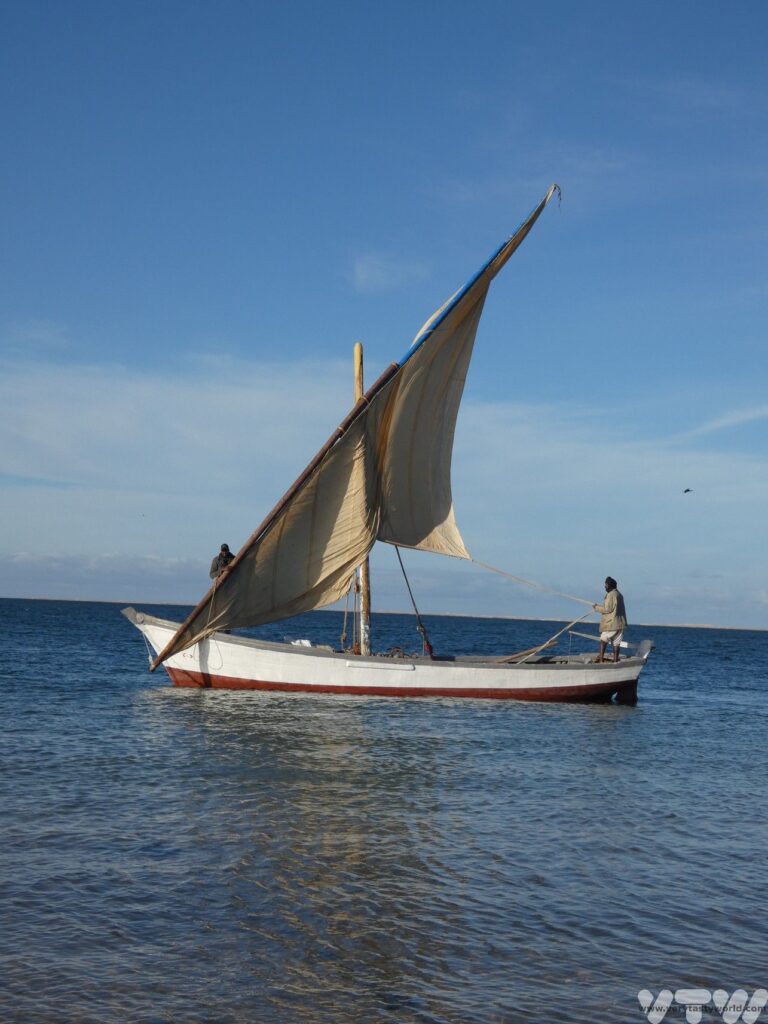 Traditional wooden sailing boat on the Atlantic ocean near Banc d’Arguin Mauritania