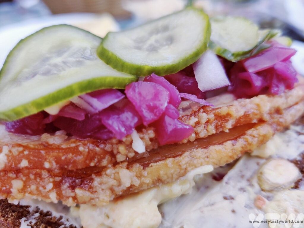 pork with crunchy crackling and red cabbage open sandwich